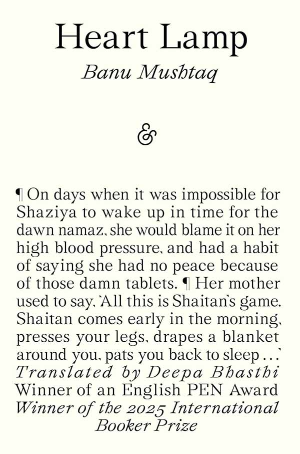 Books covered in white with handwritten titles and authors on their spines