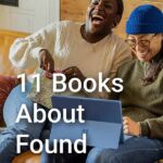best friends laughing together while looking at a laptop. Text overlay - 11 books about found family