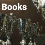 11 Books that have won awards. Trophies in the background
