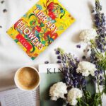Flowers, books and coffee in an aesthetic arrangement