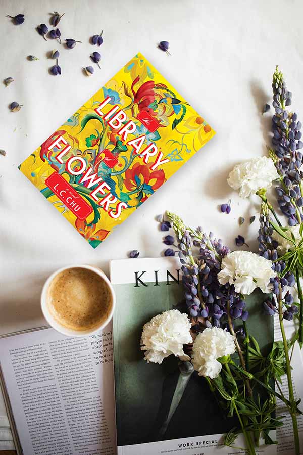 Flowers, books and coffee in an aesthetic arrangement