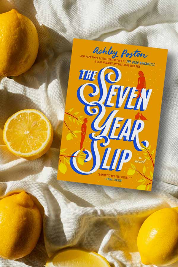 blanket with lemons and the book The Seven Year Slip by Ashley Poston